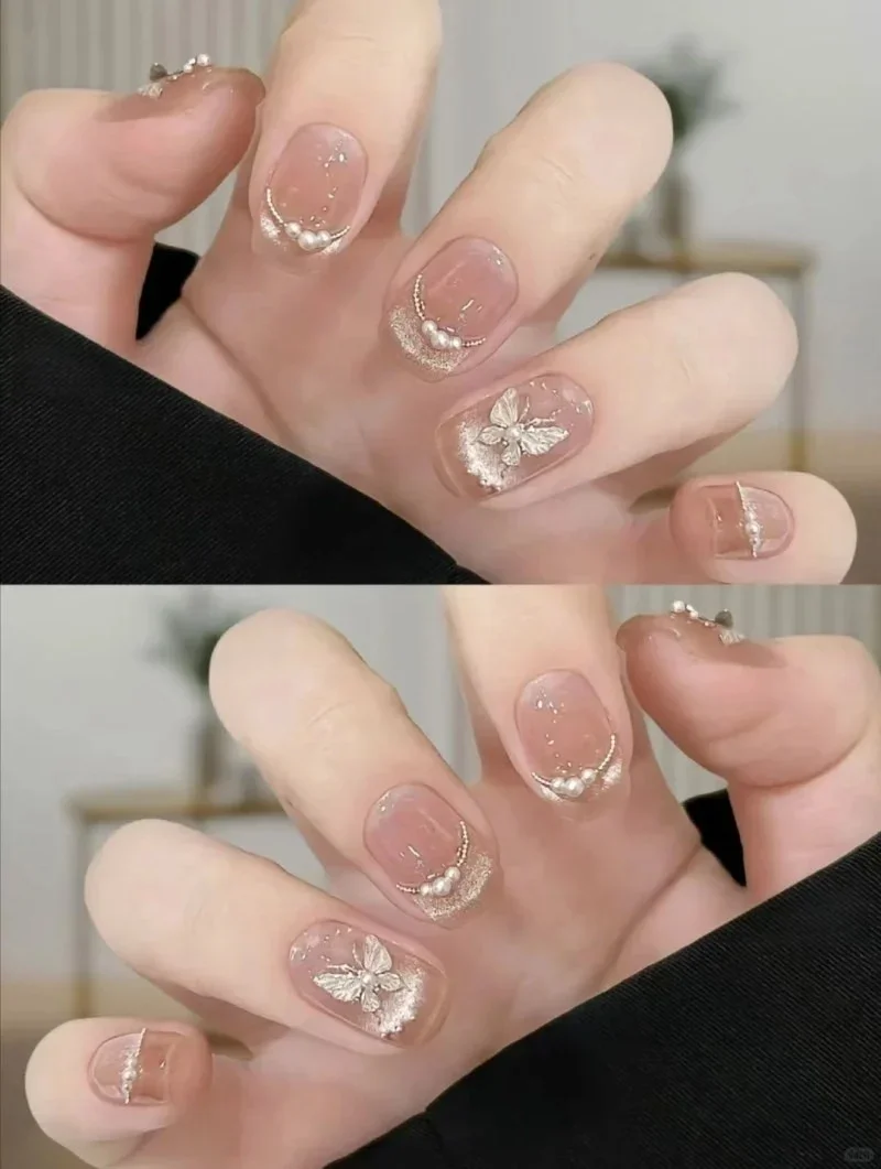 Mẫu nail mắt mèo đính charm nơ nhẹ nhàng
